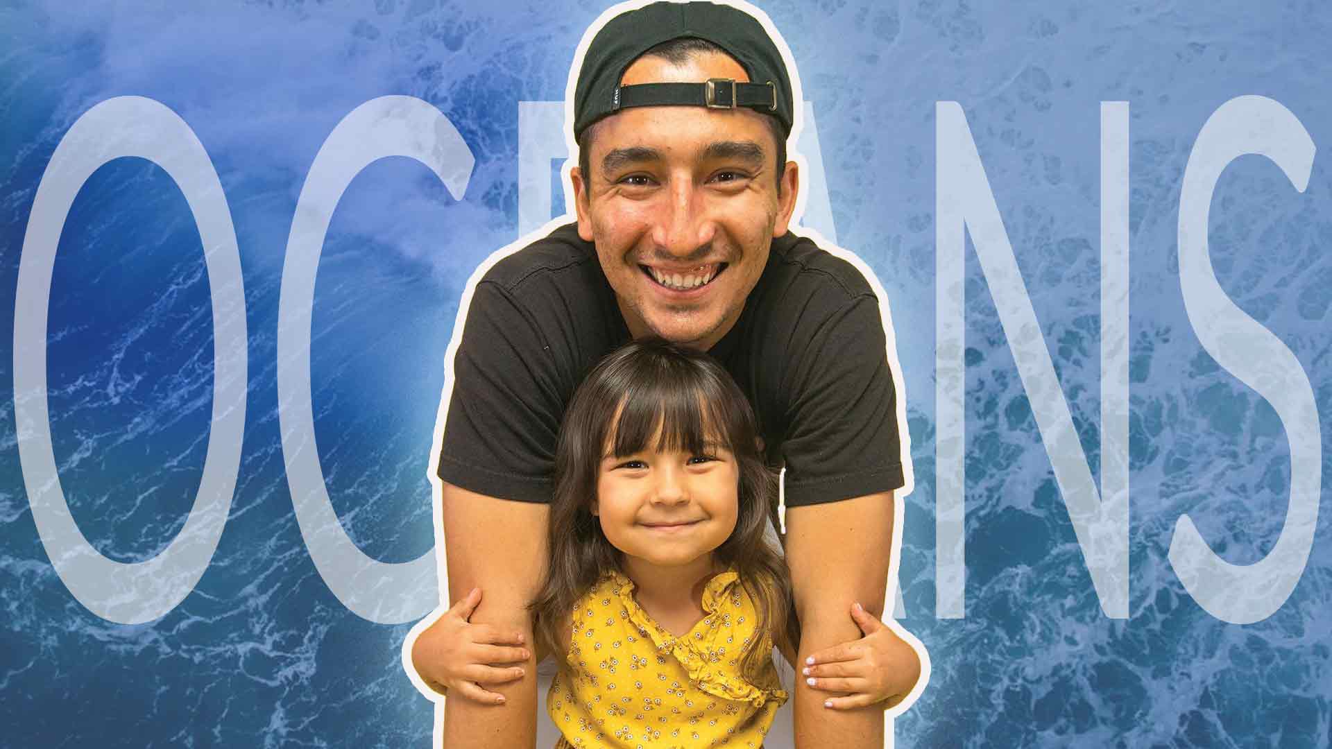 Father and Daughter - Nick and Sienna stand together in front of an ocean background